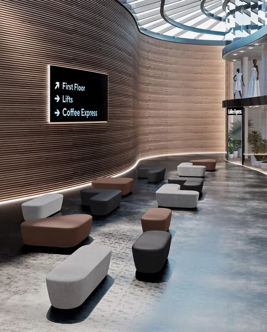 pouf colorati con usb disposti in una lounge di un centro commerciale