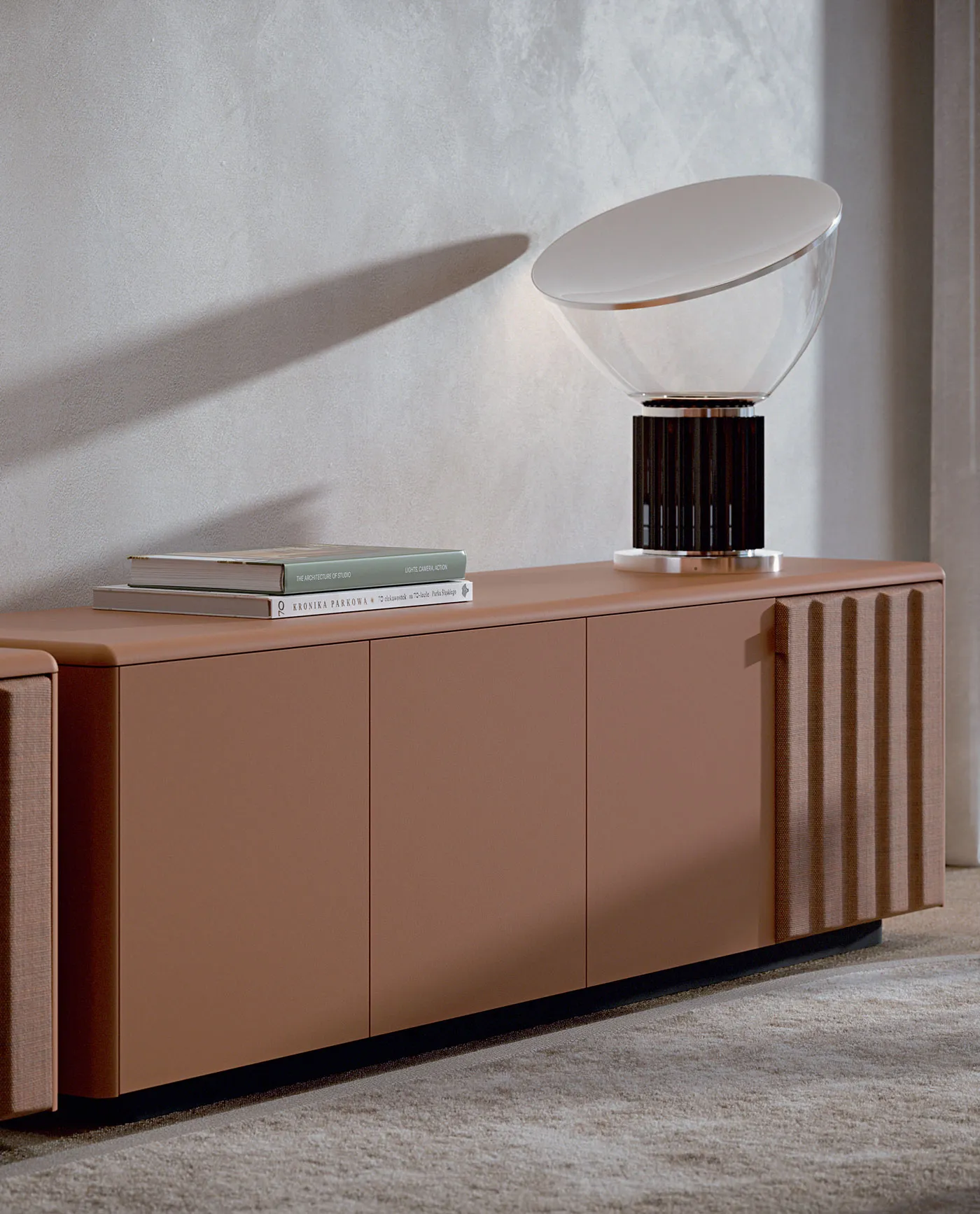 Sabree design sideboard in lacquered terracotta finish with signature undulating door pattern and designer table lamp — Italian design