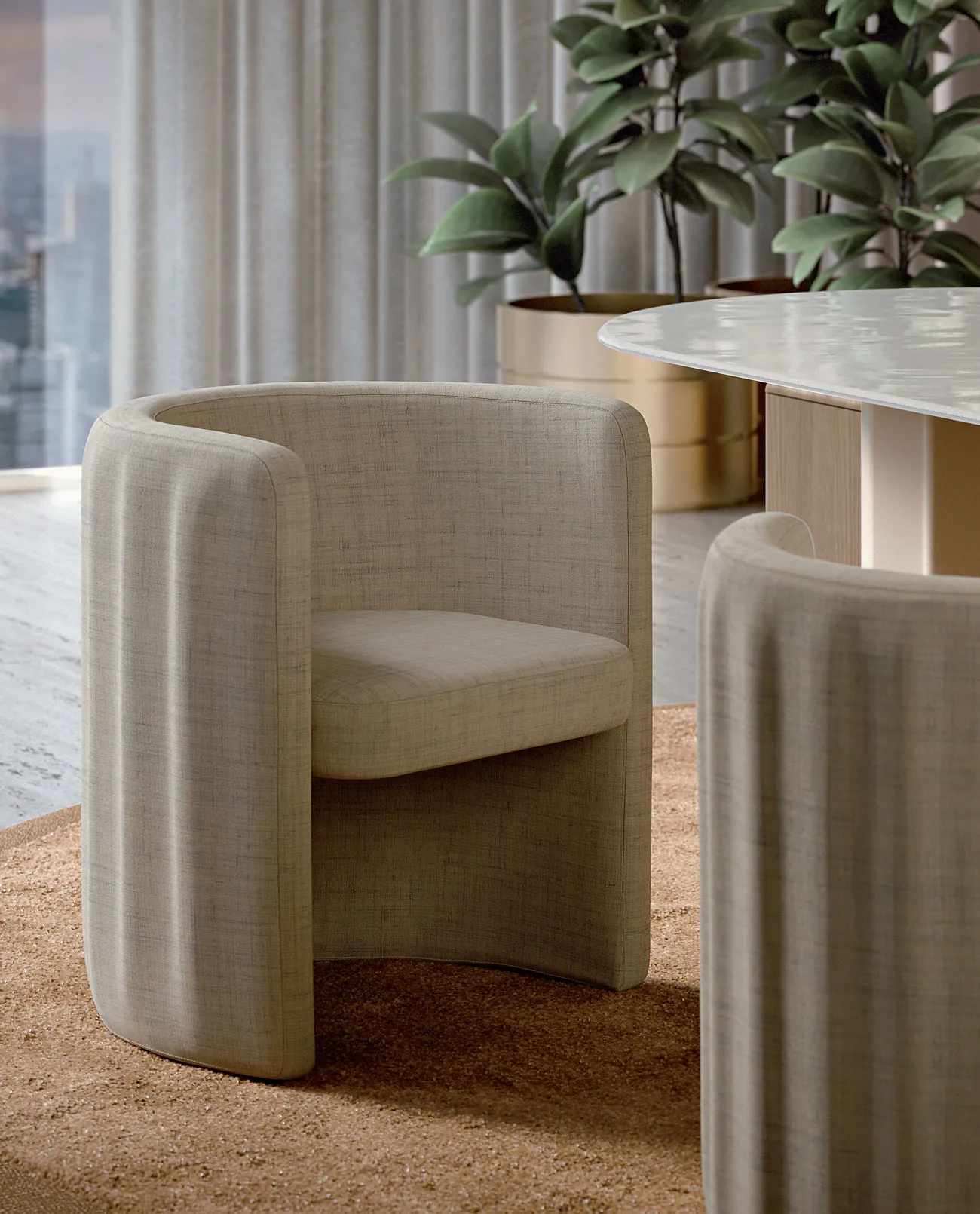 Sabree tub chair in beige bouclé upholstery, detail view alongside a marble table in a bright contemporary space with natural light — Italian design
