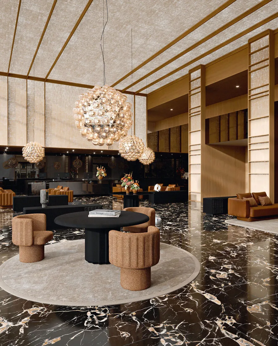 Sabree tub chair in terracotta upholstery in a luxury hotel lobby with black marble floor and crystal chandeliers — Italian design
