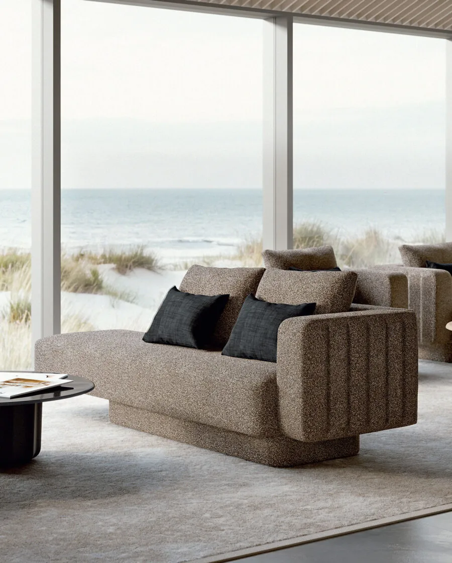 Sabree luxury sofa in taupe upholstery with blue cushions in a coastal living room with floor-to-ceiling windows and sea view — Italian design