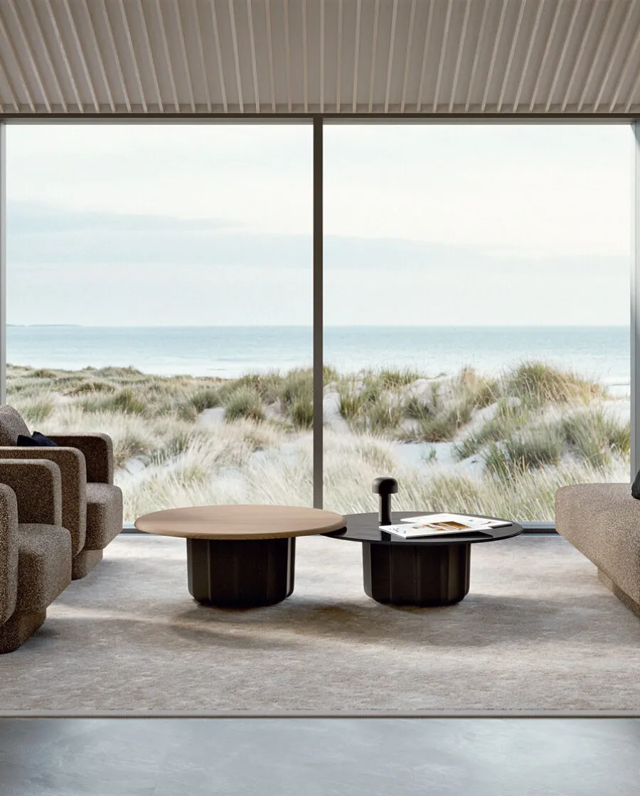 Sabree luxury sofa and designer armchair system in taupe upholstery in a minimalist coastal living room with dunes and sea view — Italian design